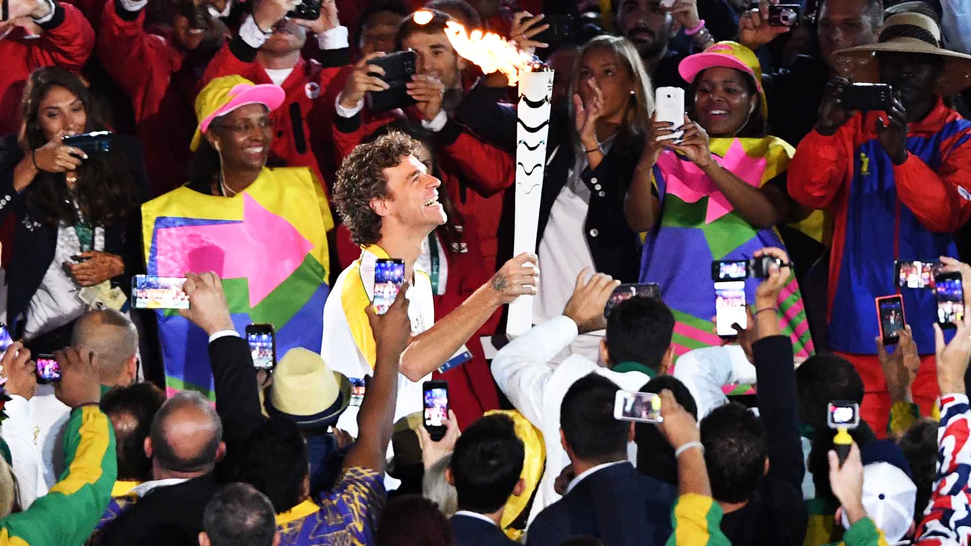 <a href='/en/players/gustavo-kuerten/k293/overview'>Gustavo Kuerten</a> carries the Olympic flame into the Maracana Stadium at the 2016 Olympic Games in Rio de Janeiro.