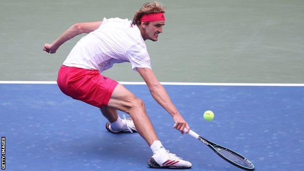 Alexander Zverev slides for a drop-shot