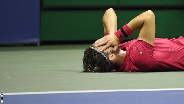 Dominic Thiem lay on court after winning the US Open title