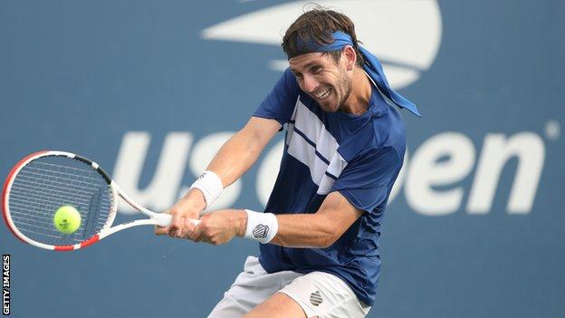 Cameron Norrie hits a backhand