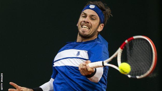 Cameron Norrie taking a shot