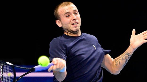 Britain's Dan Evans returns a shot against American Frances Tiafoe at the European Open in Antwerp