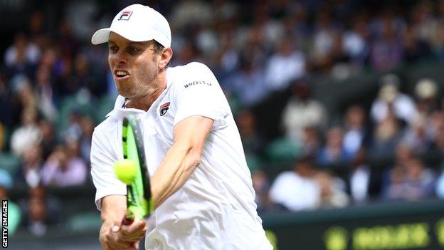 Sam Querrey hits a backhand at Wimbledon