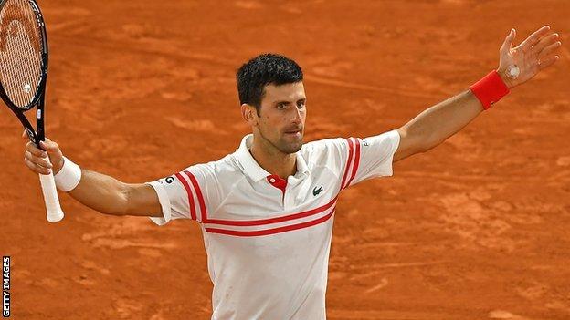Novak Djokovic celebrates beating Rafael Nadal in his semi-final